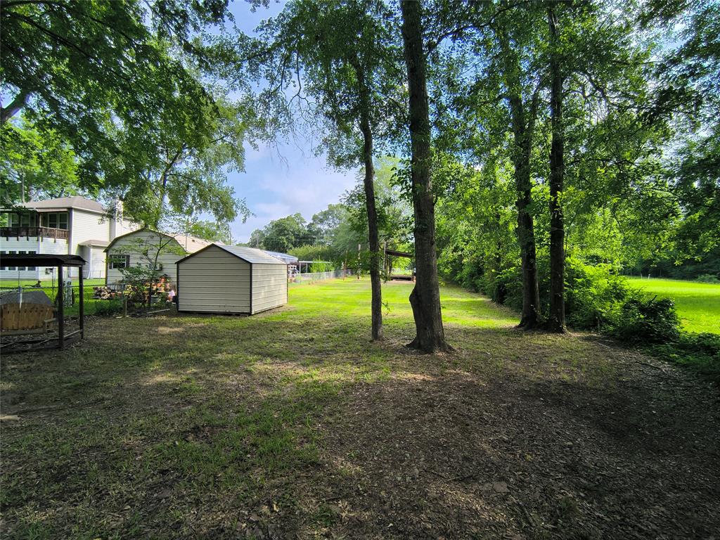 180 Arrowhead Street Mabank, TX 75156 - Photo 8 of 26 a view of a house with a backyard