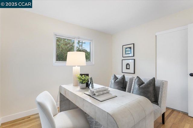 a bedroom with a bed and a lamp on table