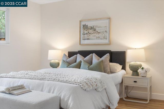 a bedroom with bed and cupboard