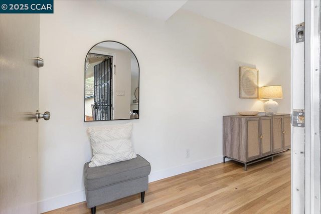 wooden floor with a bench in a room