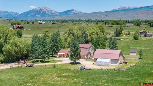 an aerial view of a house with garden