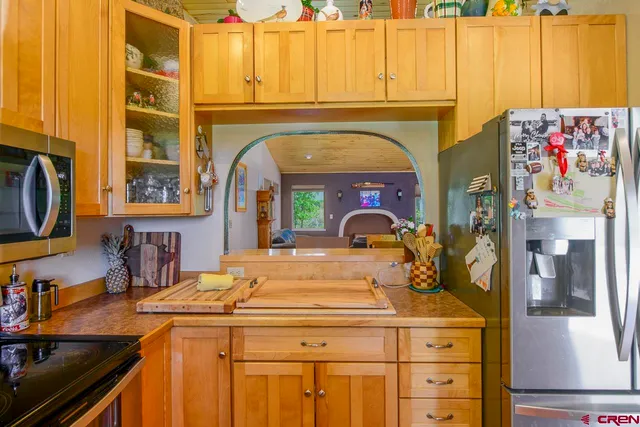 a room with a washing machine and mirror