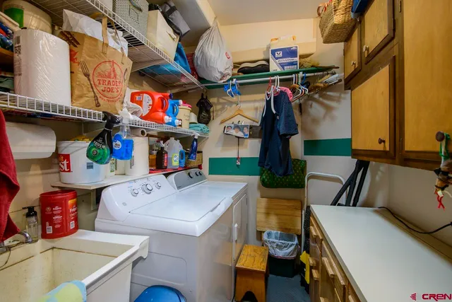 a storage room with washer and dryer
