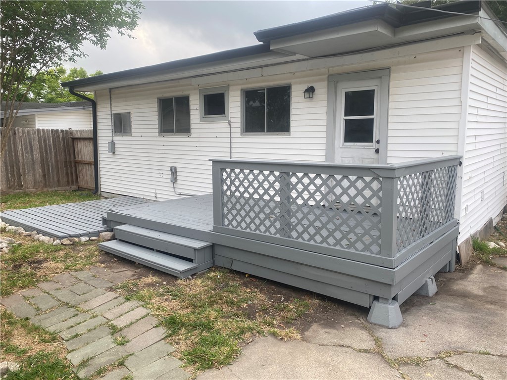 1010 Deforrest Street Corpus Christi, TX 78404 - Photo 15 of 22 a wooden bench sitting in front of a house