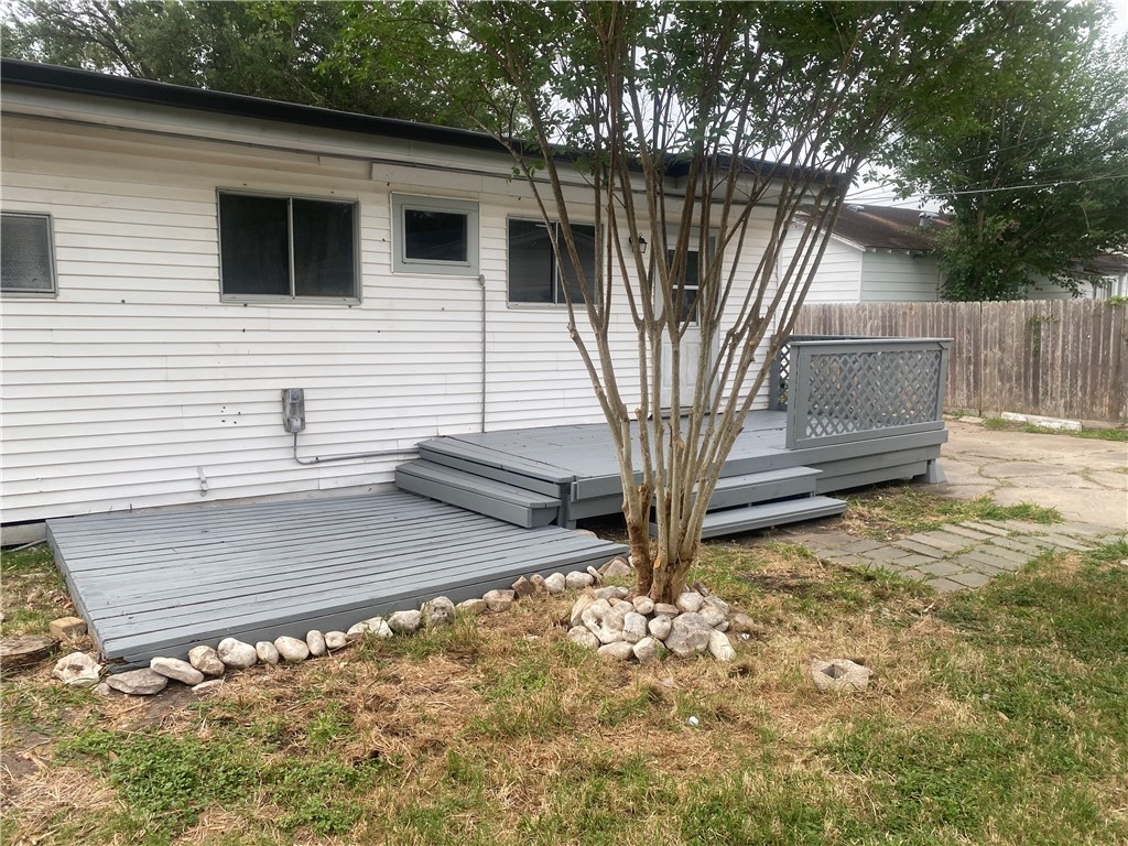 1010 Deforrest Street Corpus Christi, TX 78404 - Photo 16 of 22 a view of a house with a small yard and wooden fence