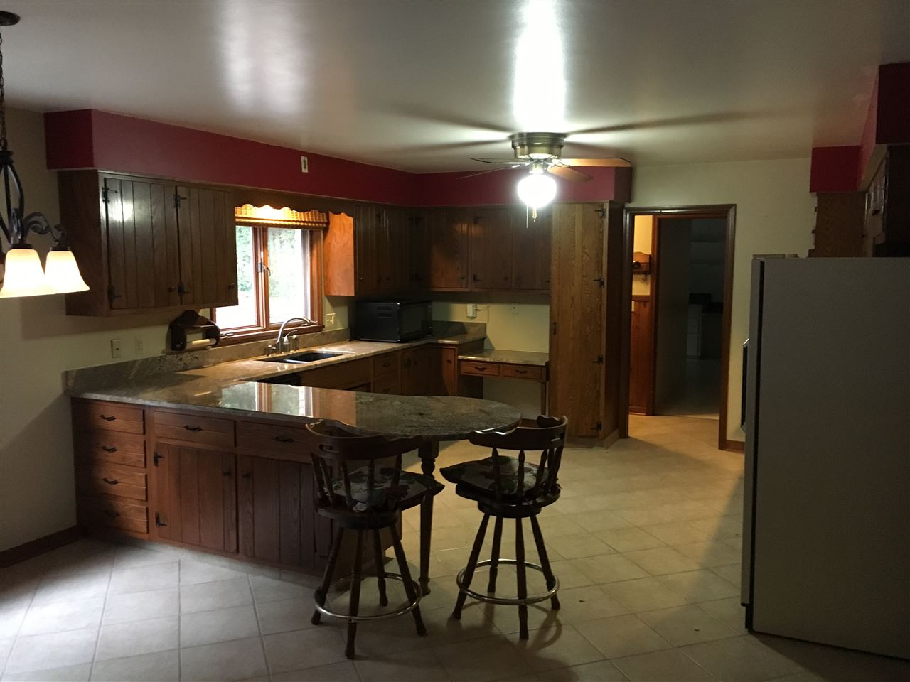 3512 Spring Creek Road Rockford, IL 61107 - Photo 8 of 25 a kitchen with a table and chairs in it