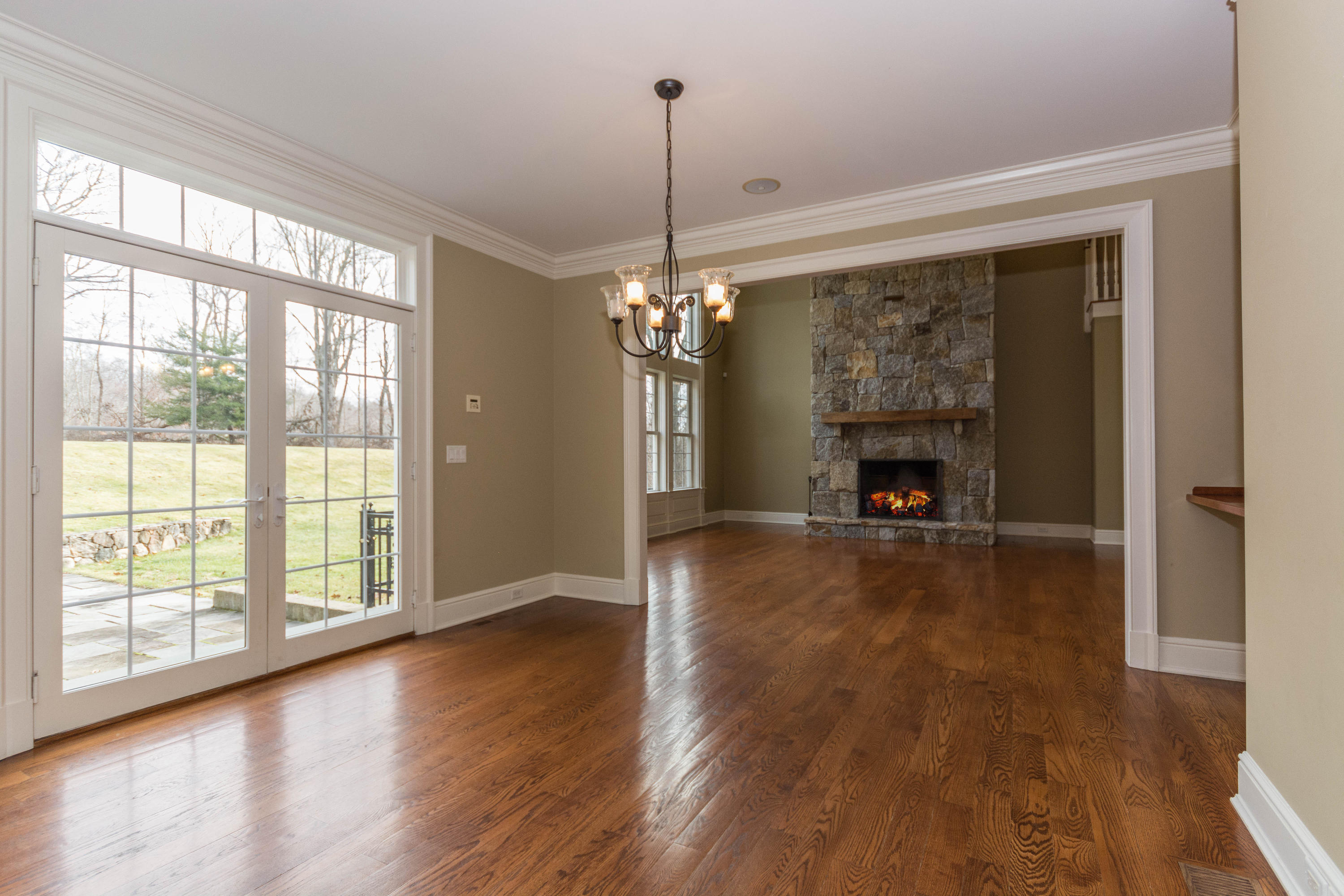 200 Limestone Road Ridgefield, CT 06877 - Photo 12 of 25 a view of empty room with wooden floor and fireplace