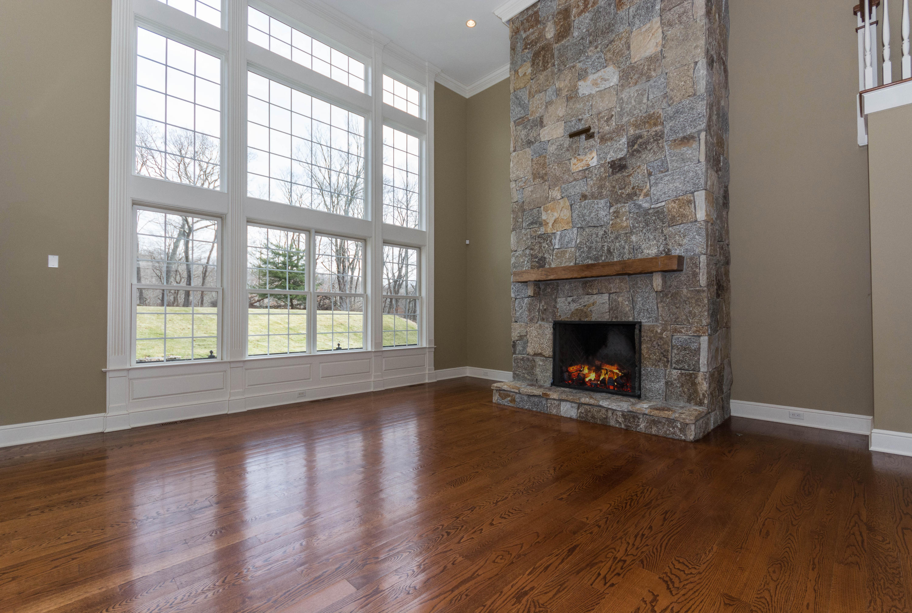 200 Limestone Road Ridgefield, CT 06877 - Photo 13 of 25 wooden floor with fireplace in living room