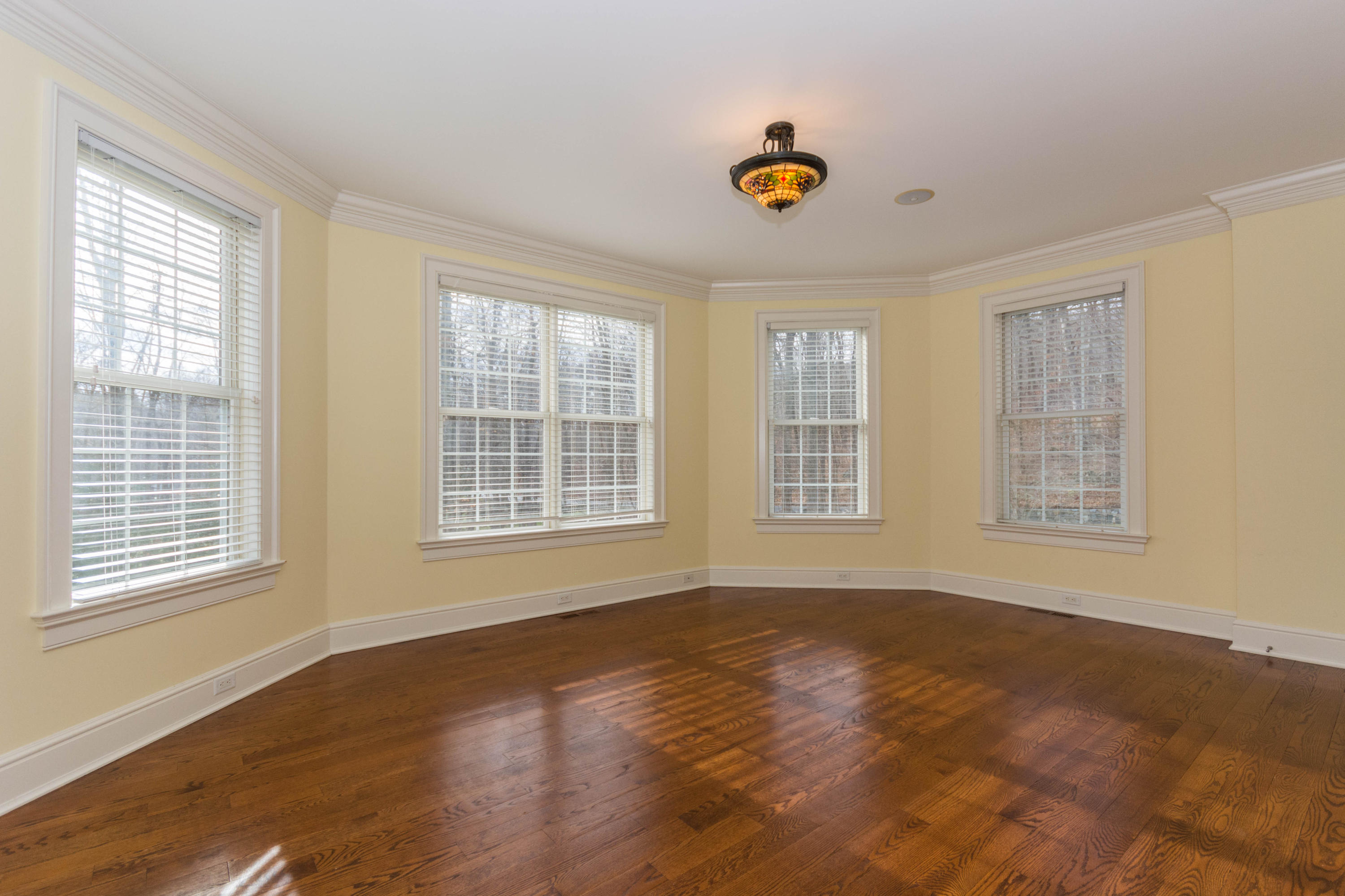 200 Limestone Road Ridgefield, CT 06877 - Photo 15 of 25 a view of an empty room with wooden floor and a window