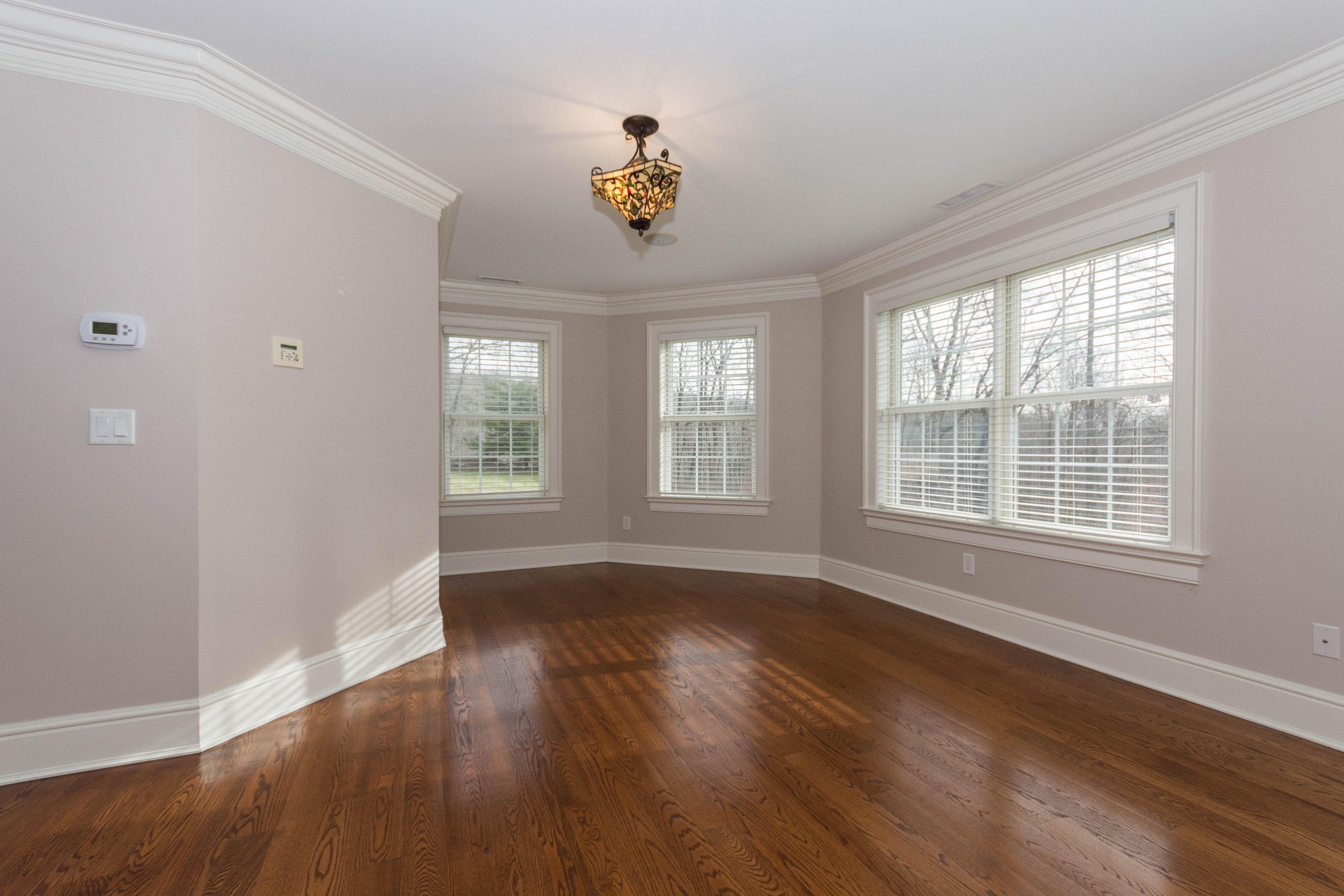 200 Limestone Road Ridgefield, CT 06877 - Photo 18 of 25 a view of an empty room with wooden floor and a window