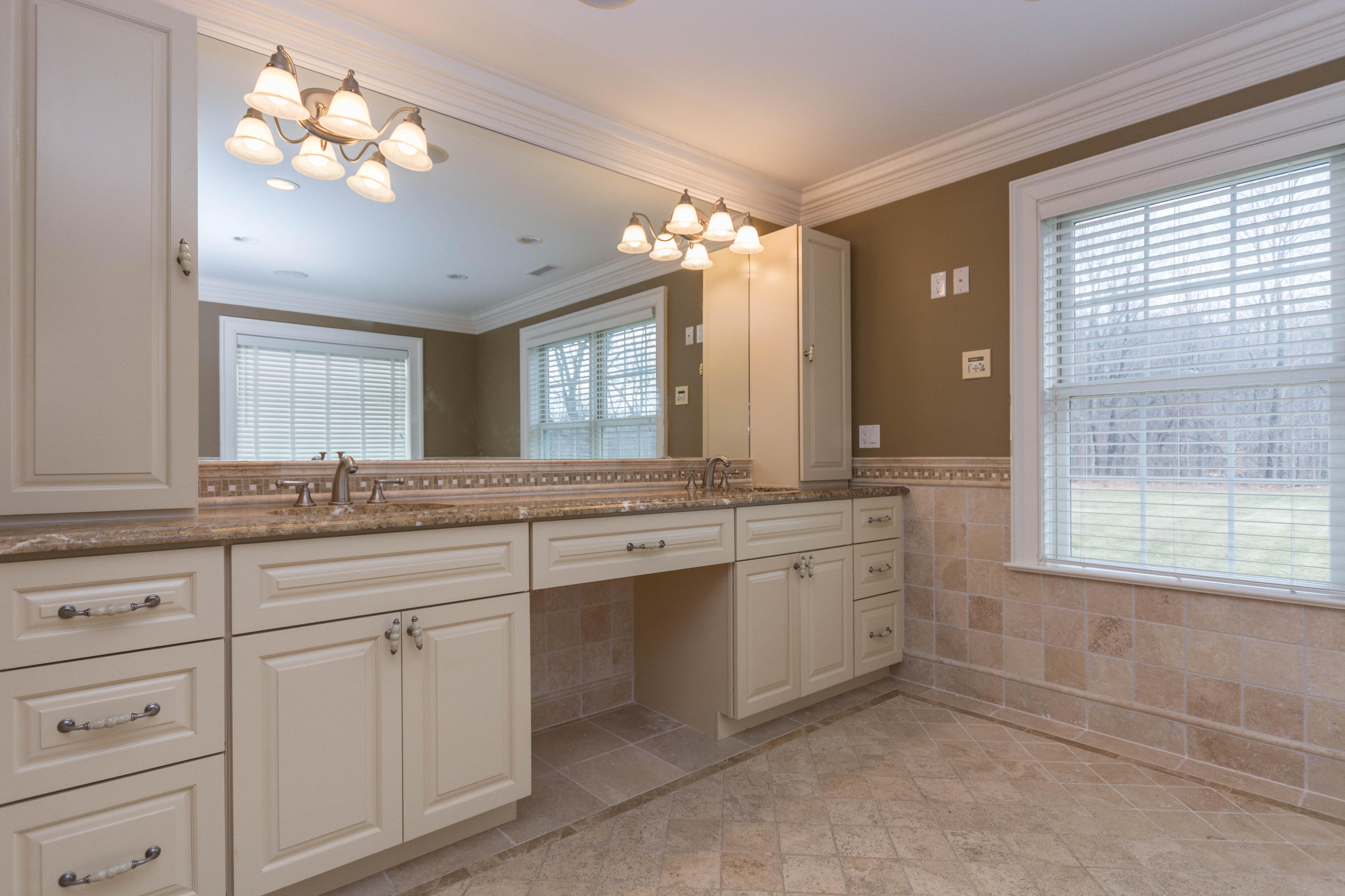 200 Limestone Road Ridgefield, CT 06877 - Photo 19 of 25 a bathroom with a sink vanity and mirror