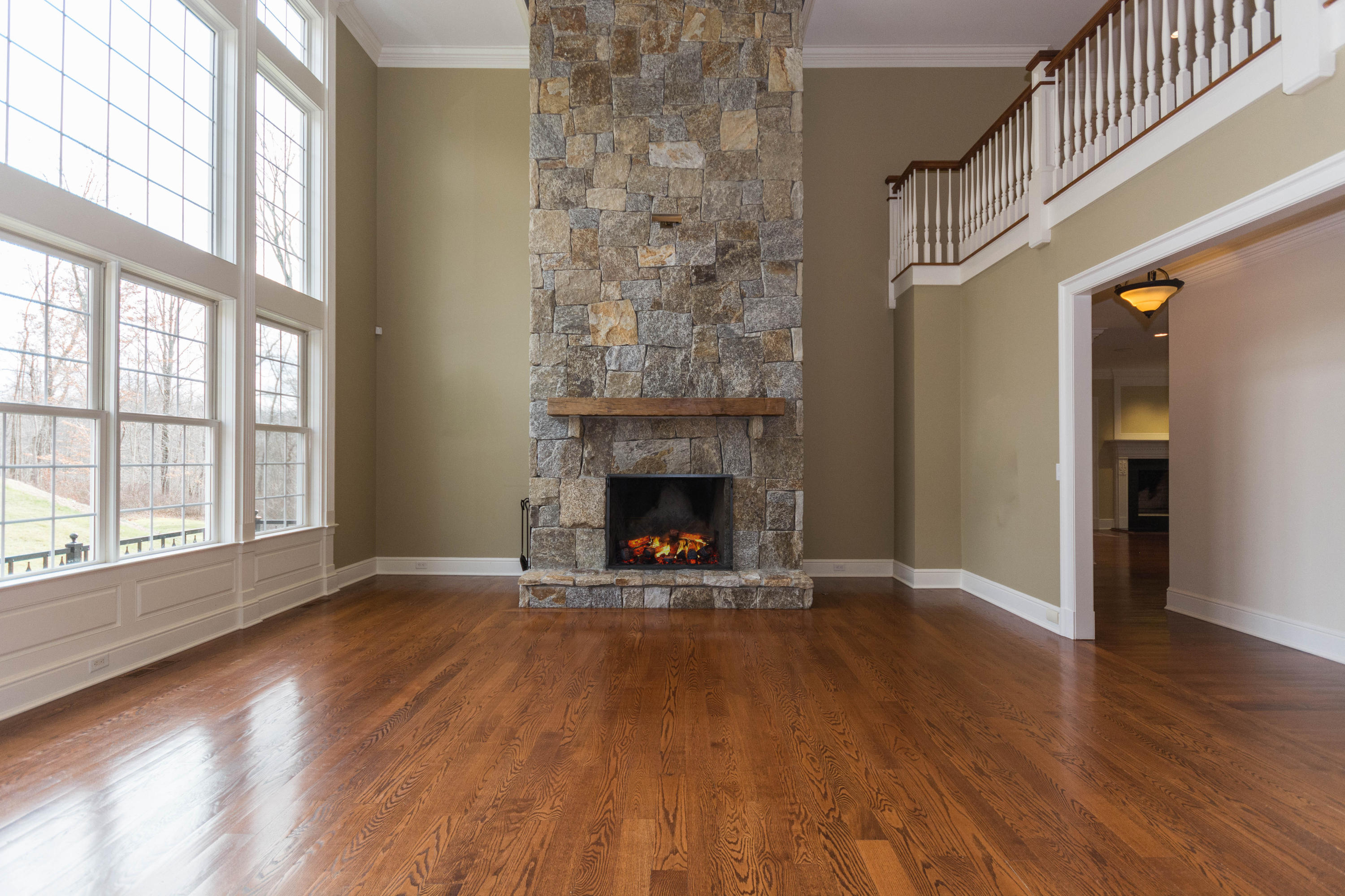 200 Limestone Road Ridgefield, CT 06877 - Photo 10 of 25 a view of an empty room with wooden floor fireplace and a window