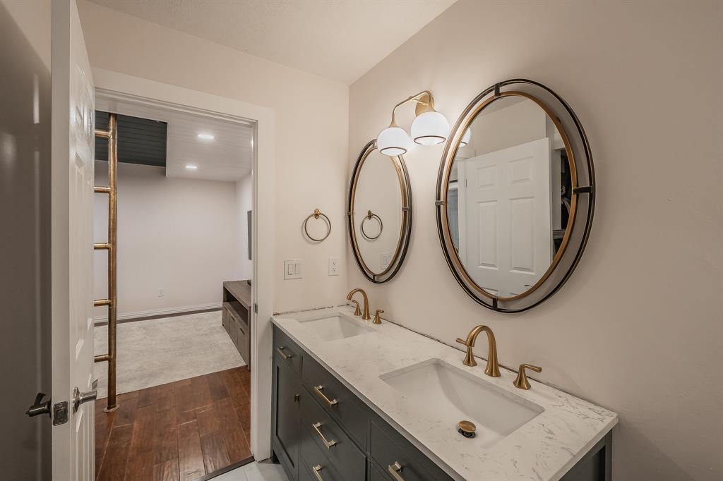14151 Montfort Drive, Unit 332 Dallas, TX 75254 - Photo 23 of 35 a bathroom with a sink and a mirror