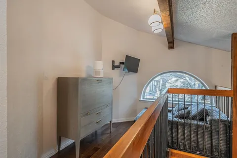 a bedroom with furniture and a window