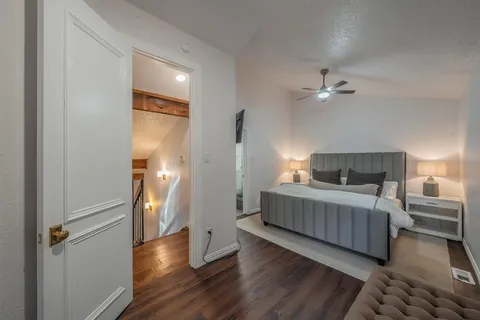 a bedroom with a bed and a flat screen tv