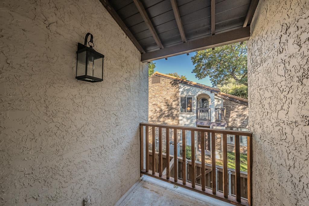 14151 Montfort Drive, Unit 332 Dallas, TX 75254 - Photo 30 of 35 a view of balcony with wooden floor