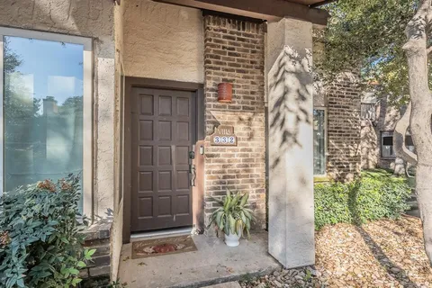 a bathroom with a shower and a mirror
