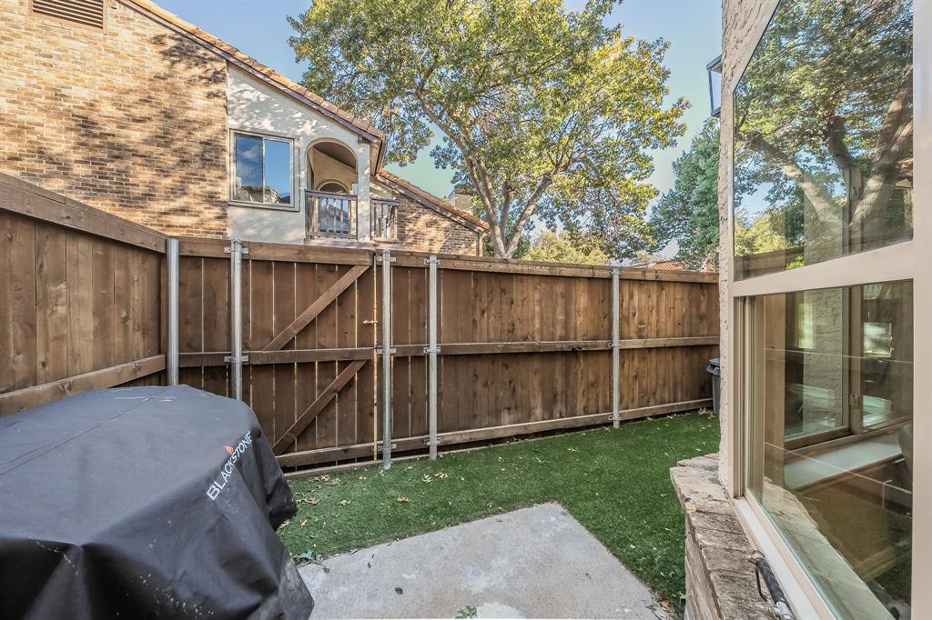 14151 Montfort Drive, Unit 332 Dallas, TX 75254 - Photo 31 of 35 a view of a backyard with a large tree