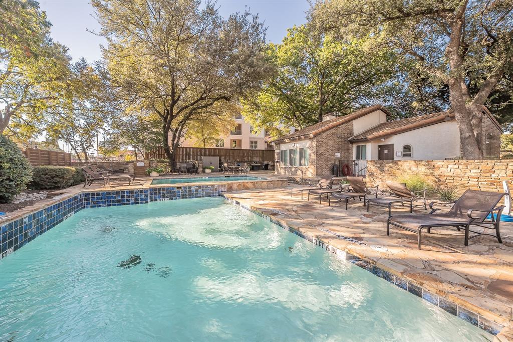 14151 Montfort Drive, Unit 332 Dallas, TX 75254 - Photo 34 of 35 a swimming pool with outdoor seating and yard