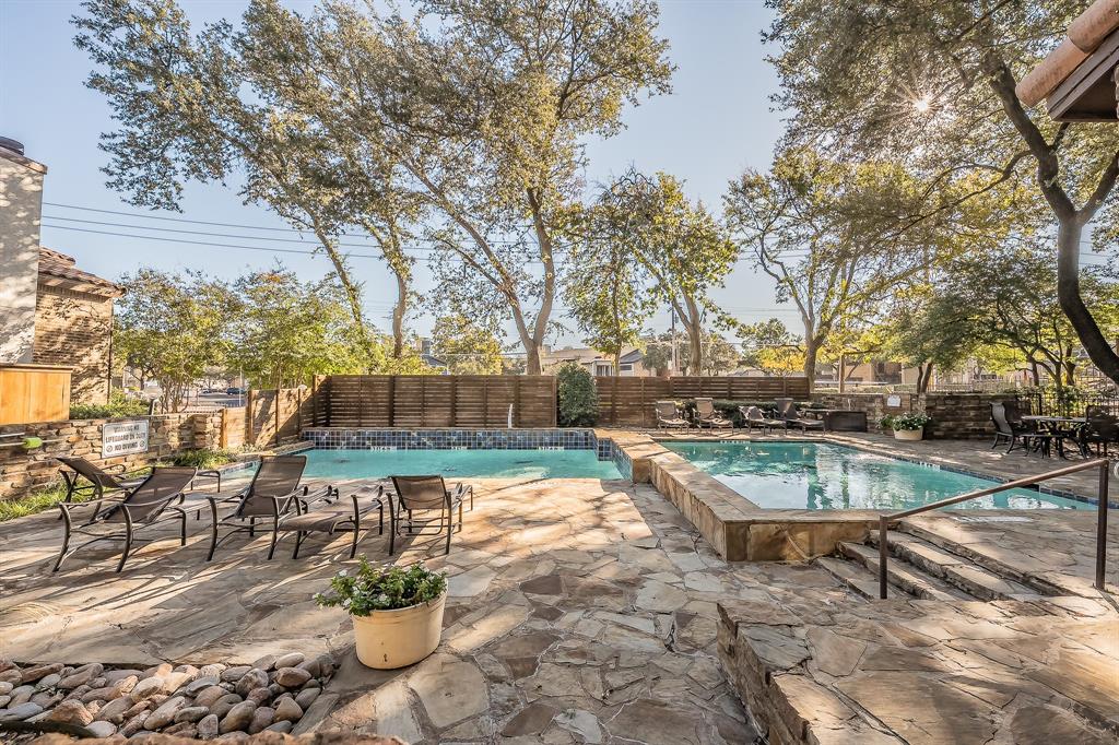 14151 Montfort Drive, Unit 332 Dallas, TX 75254 - Photo 35 of 35 a view of a swimming pool with a patio and a yard