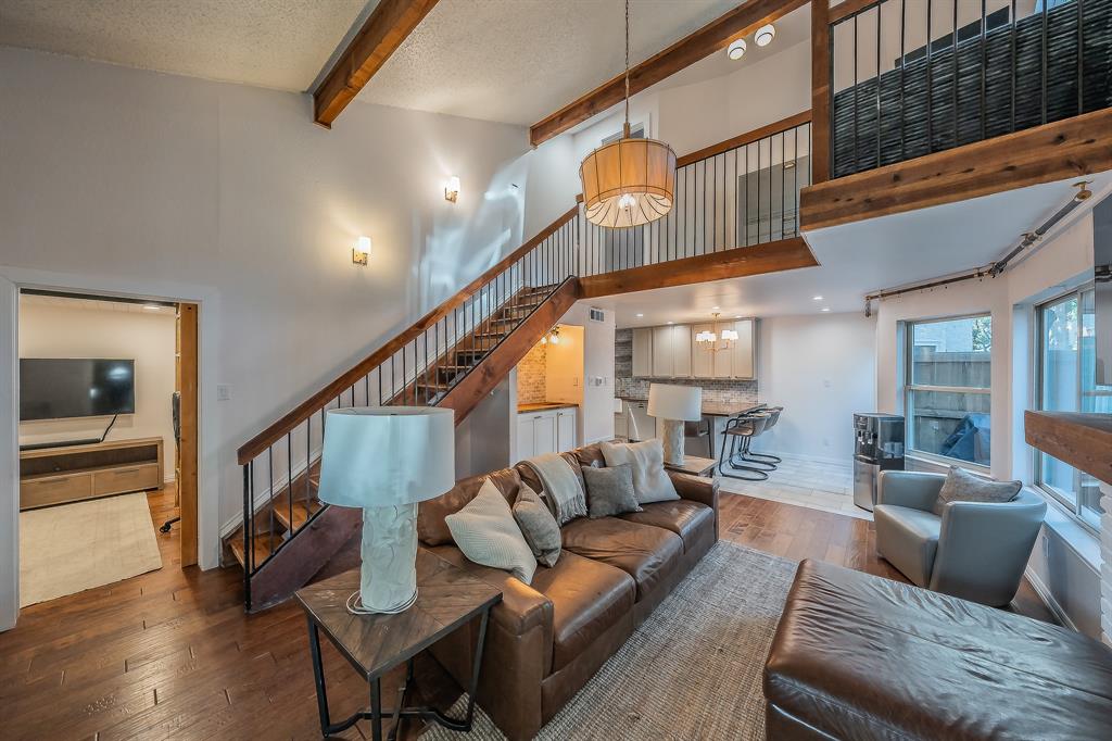 14151 Montfort Drive, Unit 332 Dallas, TX 75254 - Photo 5 of 35 a living room with furniture and wooden floor