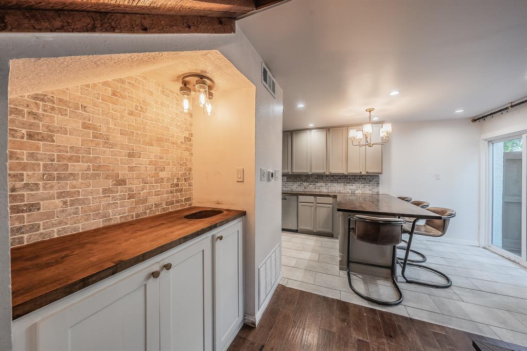 14151 Montfort Drive, Unit 332 Dallas, TX 75254 - Photo 7 of 35 a bathroom with a granite countertop sink a mirror and shower