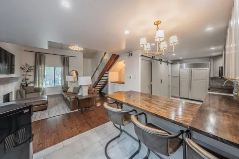 a kitchen with a stove a sink and a refrigerator