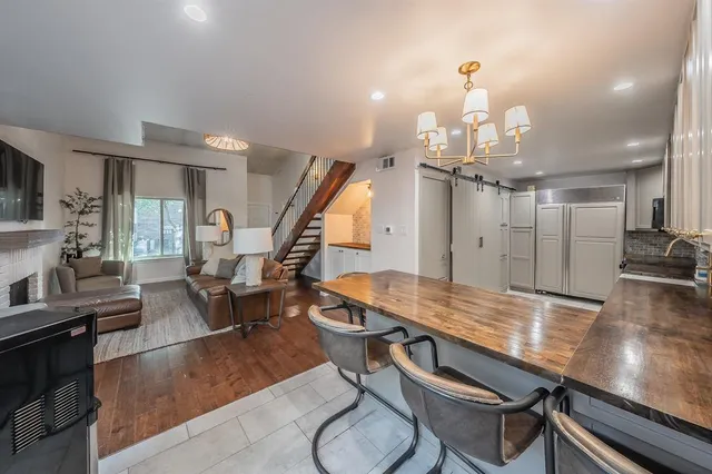 a kitchen with a stove a sink and a refrigerator