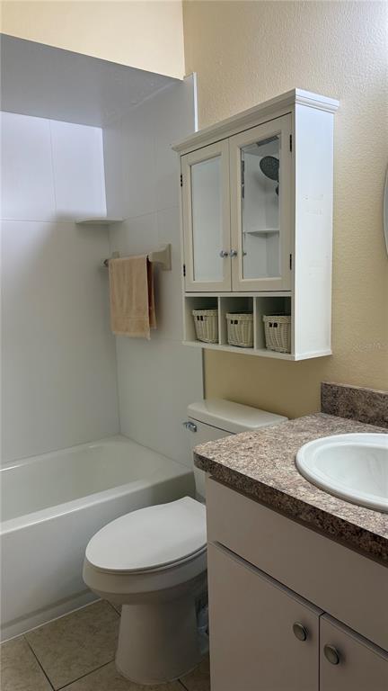 3956 Elvira Court New Port Richey, FL 34655 - Photo 13 of 21 a bathroom with a granite countertop sink toilet and shower