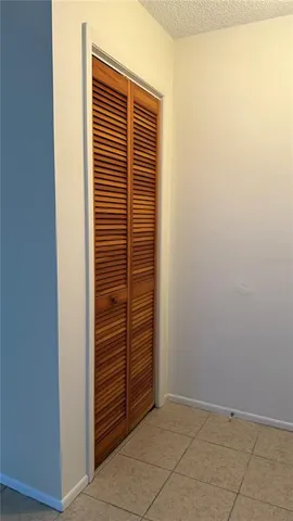 a view of bathroom with shower and a window