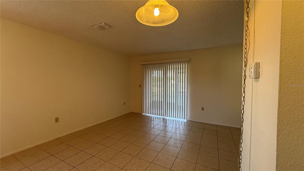 3956 Elvira Court New Port Richey, FL 34655 - Photo 3 of 21 a view of an empty room and window