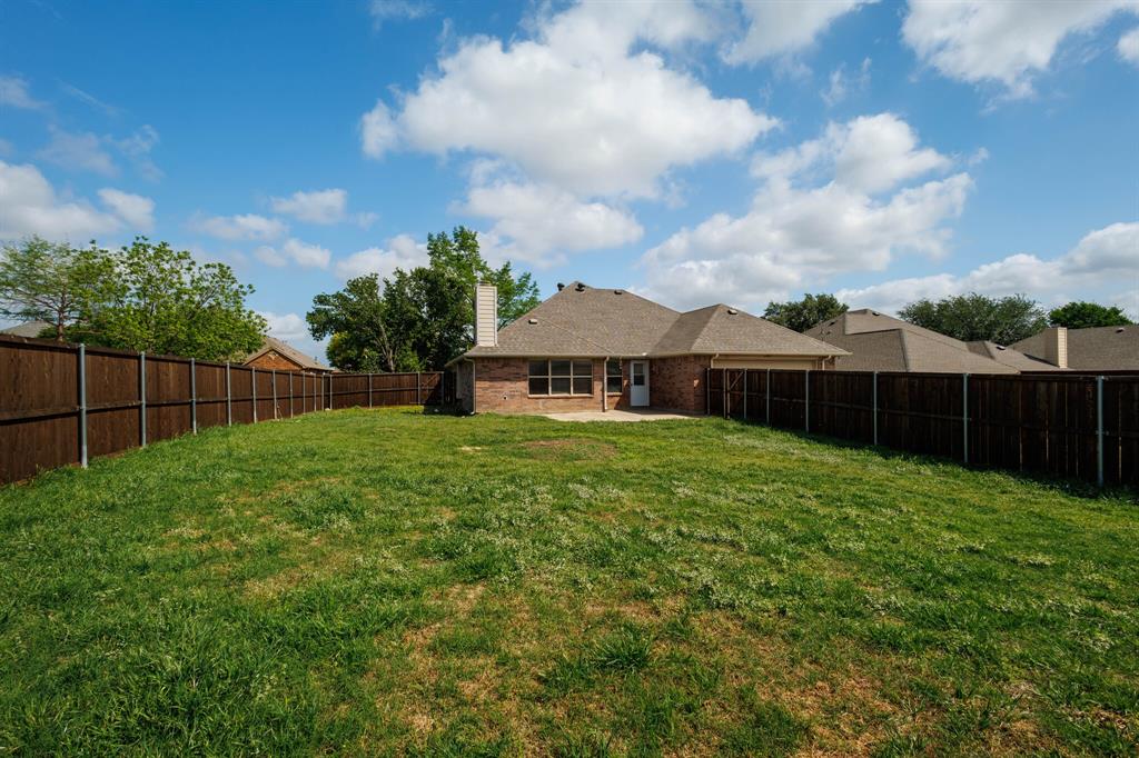 12405 Ark Road Frisco, TX 75035 - Photo 29 of 34 Fenced backyard featuring a patio area