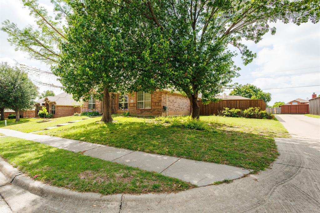 12405 Ark Road Frisco, TX 75035 - Photo 32 of 34 View of property hidden behind natural elements featuring brick siding