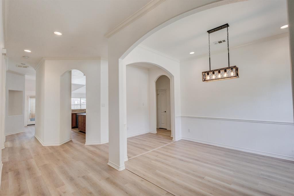 12405 Ark Road Frisco, TX 75035 - Photo 8 of 34 Unfurnished room with recessed lighting, light wood finished floors, arched walkways, and ornamental molding