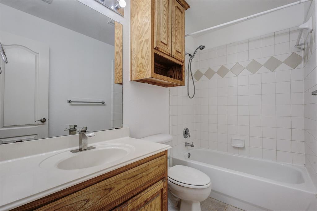 12405 Ark Road Frisco, TX 75035 - Photo 10 of 34 Bathroom with vanity and tub / shower combination