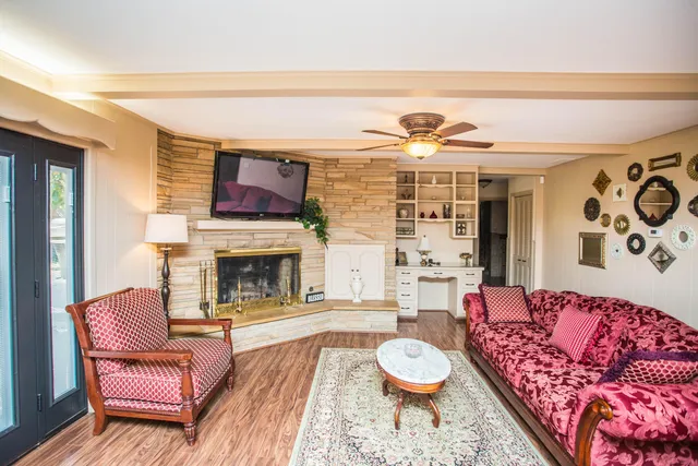 a living room with furniture and a fireplace