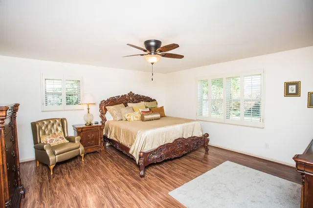 a bedroom with a bed and a couch