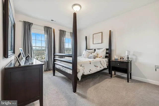 a bed room with furniture and a window