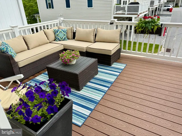 a view of a patio with couches and potted plants
