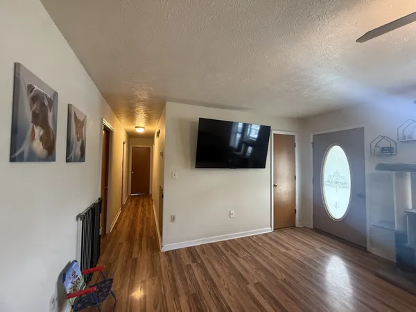 a view of a livingroom with wooden floor