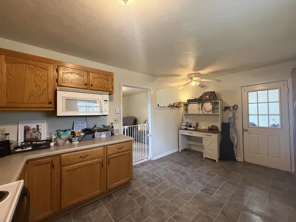 a kitchen with sink cabinets and window
