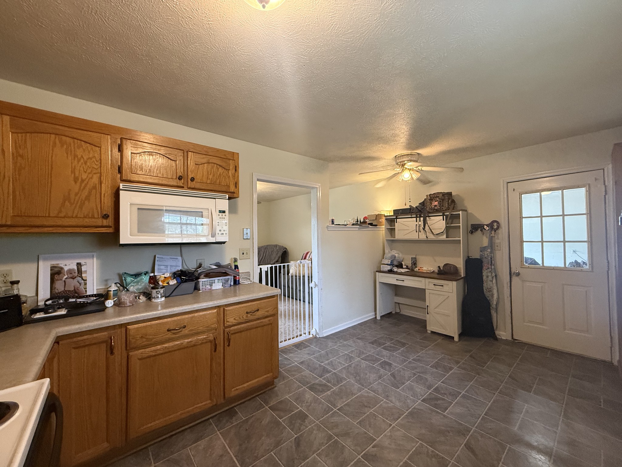 150 Deerwood Road Hohenwald, TN 38462 - Photo 13 of 56 a kitchen with sink cabinets and window