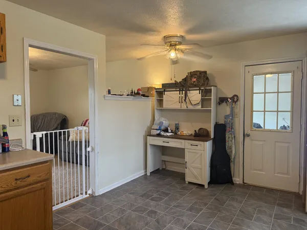 a kitchen with a cabinets and white appliances