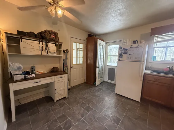 a view of a white house with a large window