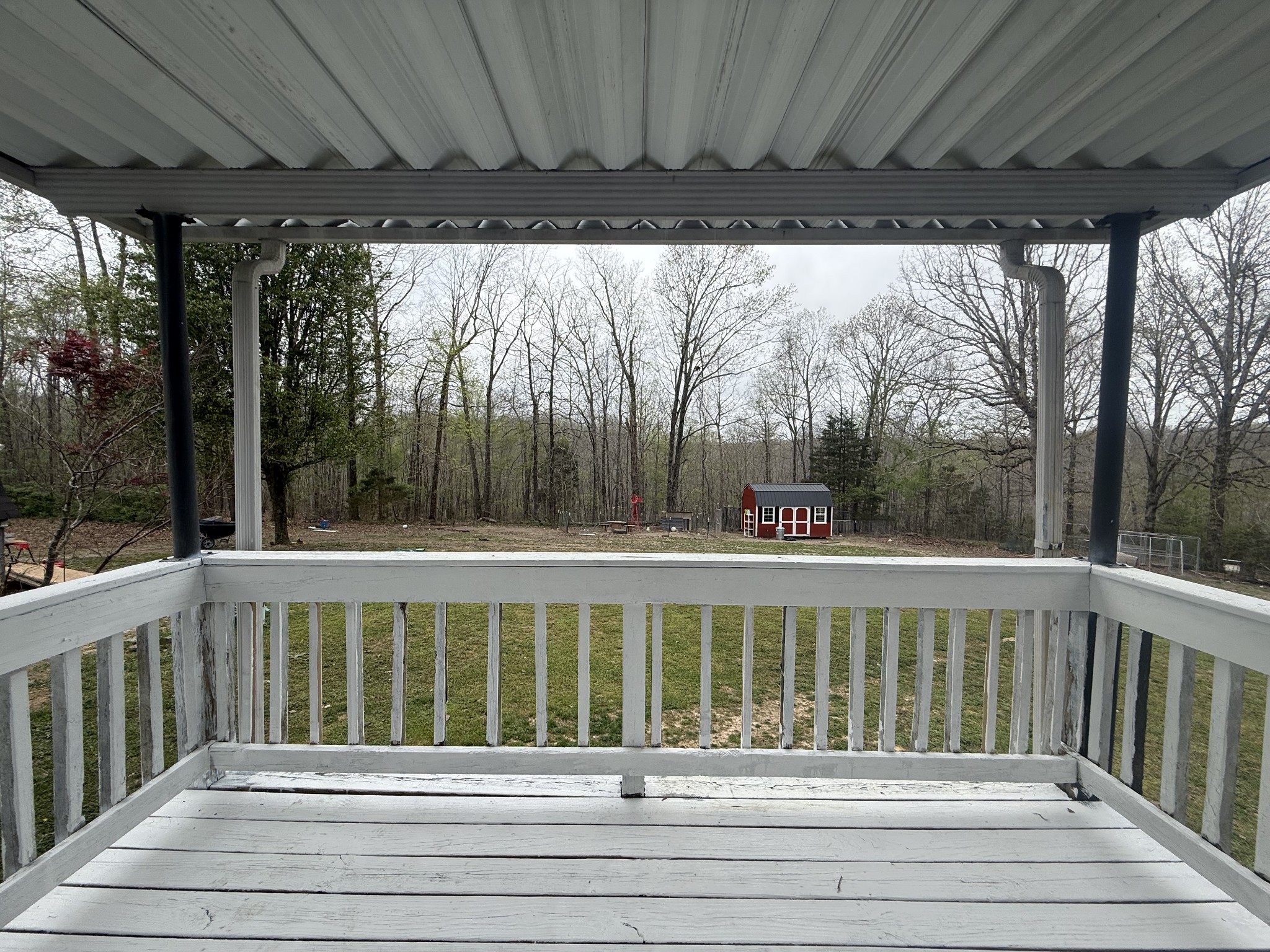 150 Deerwood Road Hohenwald, TN 38462 - Photo 19 of 56 a view of a white house with a large window