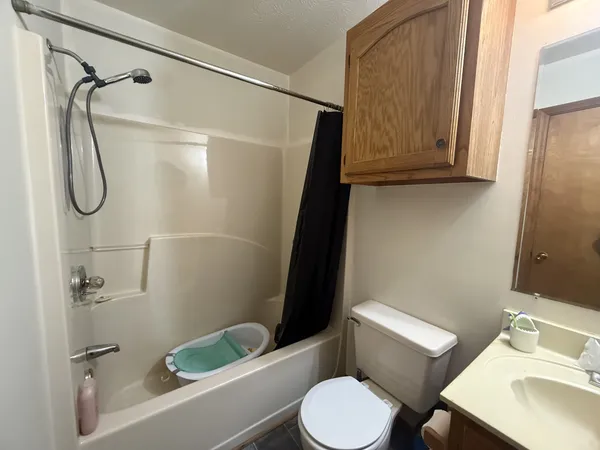 a bedroom with a bed and a mirror