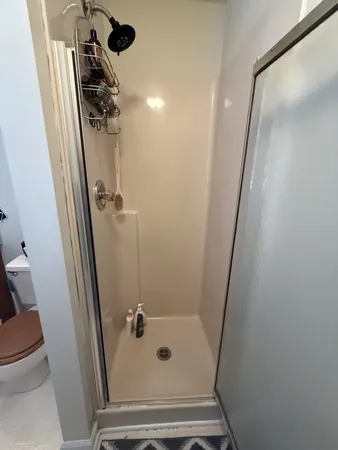 a bathroom with a sink a toilet a mirror and vanity