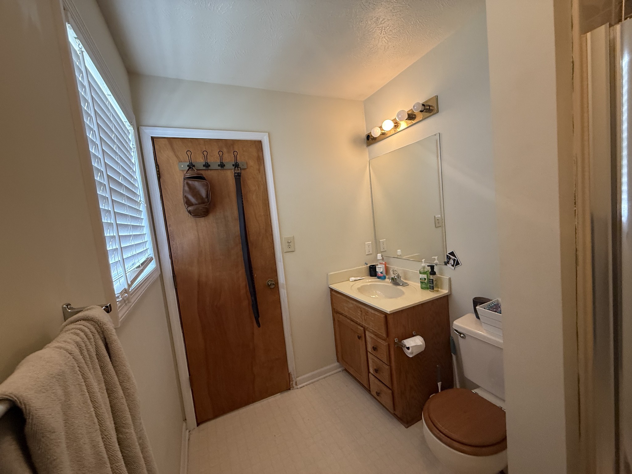 150 Deerwood Road Hohenwald, TN 38462 - Photo 37 of 56 a bathroom with a sink a toilet and mirror