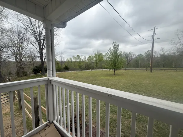 a view of outdoor space with deck and yard