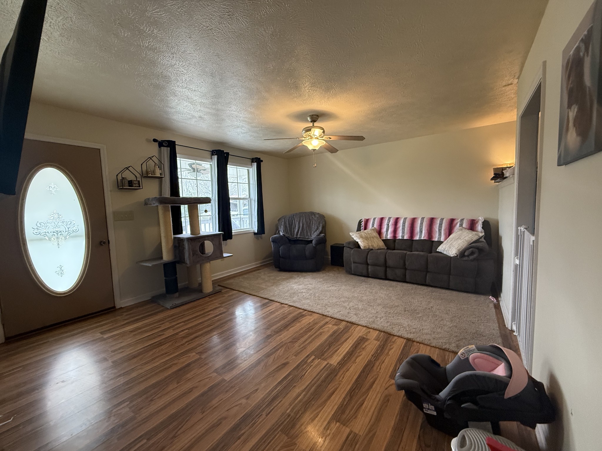 150 Deerwood Road Hohenwald, TN 38462 - Photo 9 of 56 a view of a livingroom with furniture and wooden floor